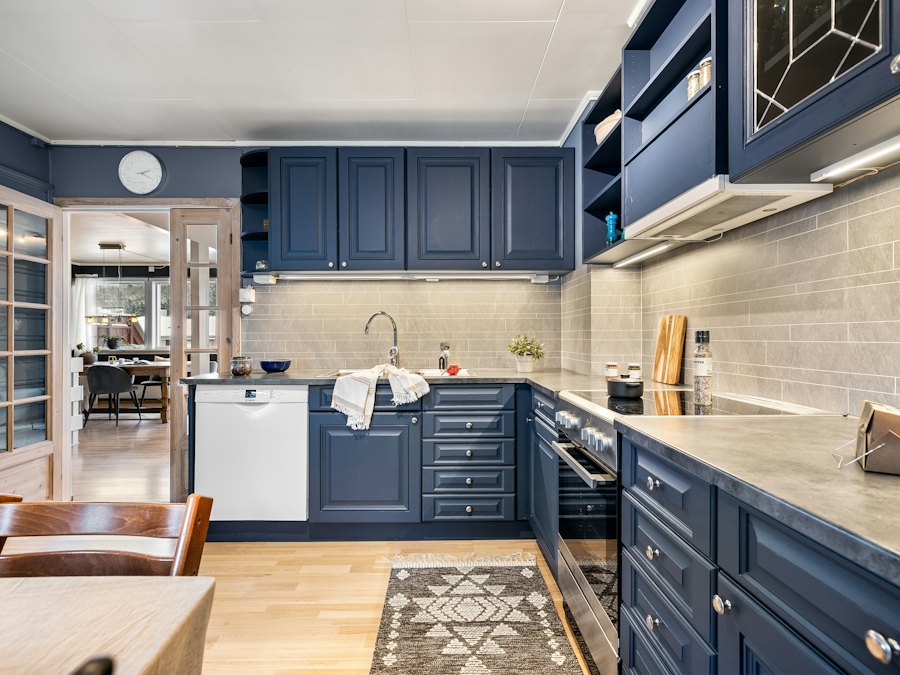 Kitchen with navy blue shaker cabinets